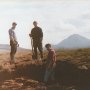 three young irish men taking a break after cutting turf on the bog at gweedore county donegal with mount errigal in the background